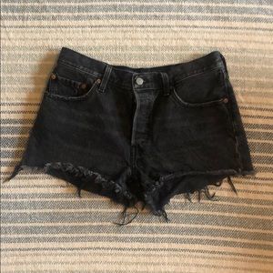 Faded black Levi’s 501 original denim shorts